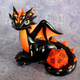 Illustration for article titled Adorable sculpted dragons guard your 20-sided dice